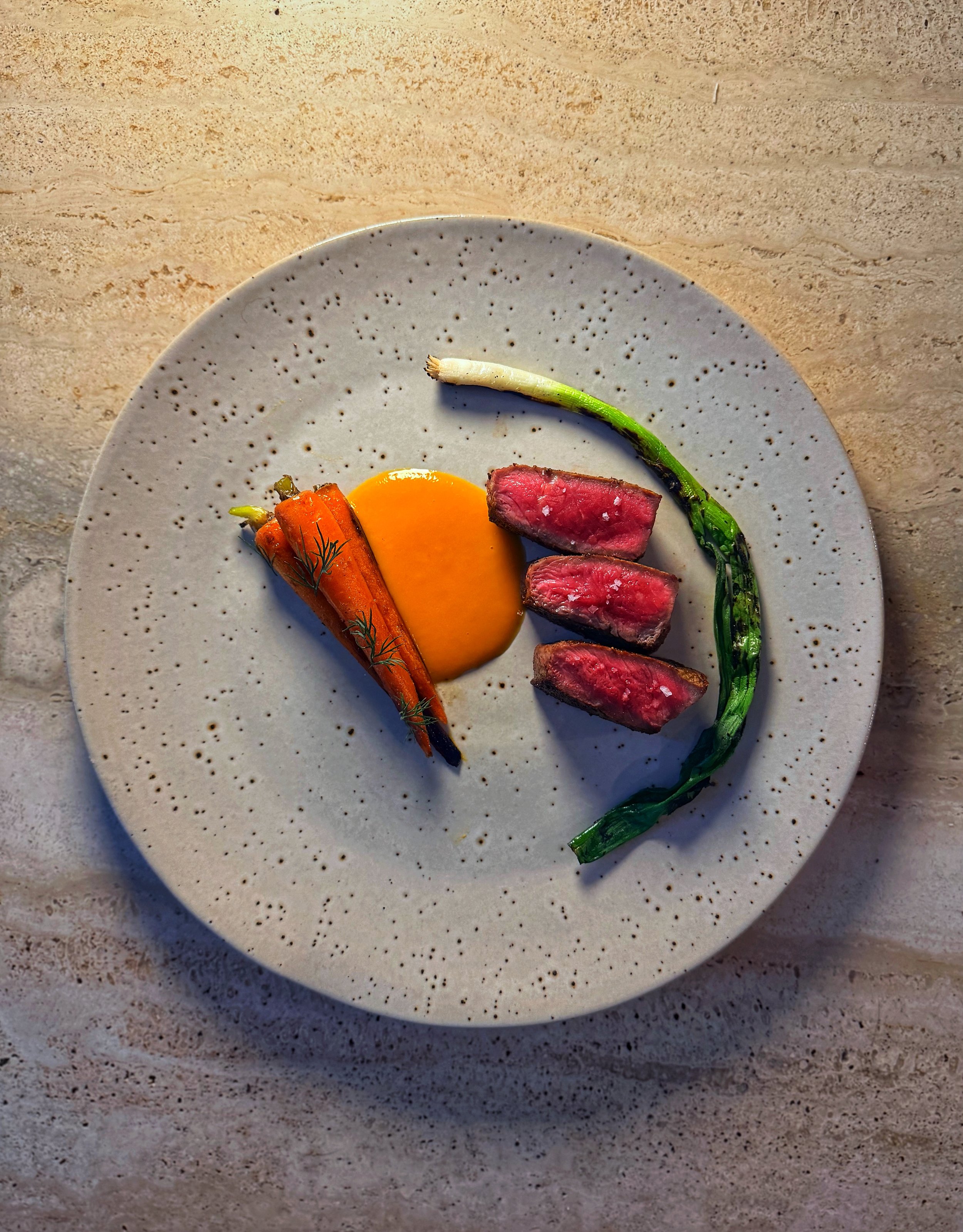 Sliced steak with seasonal vegetables